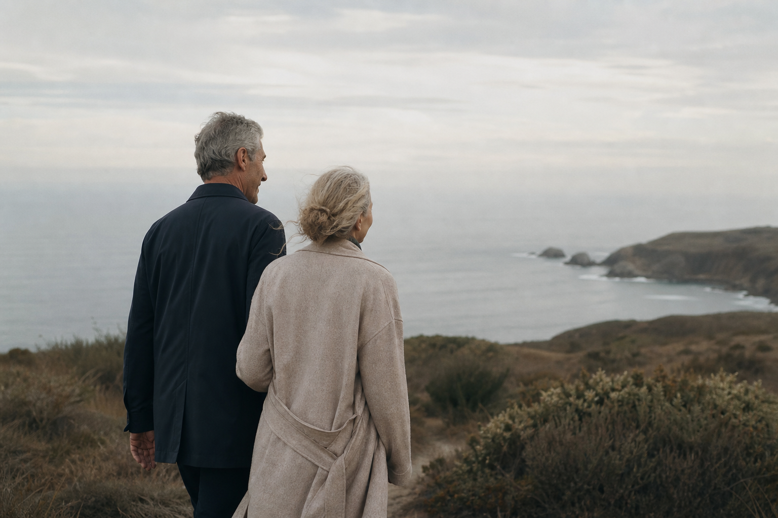 Two adults on a quiet coastal overlook